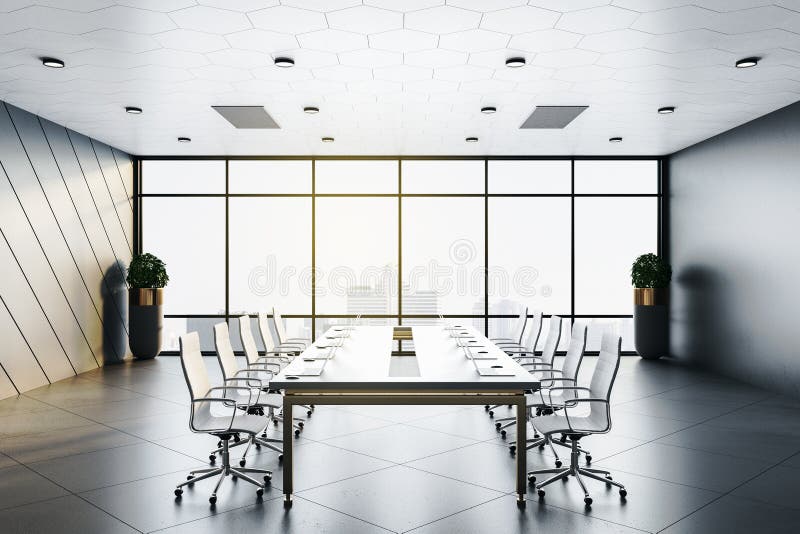 Conference Room Interior with Laptops on Table and City View Stock
