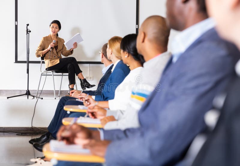 Confident asian woman lecturing during business seminar royalty free stock photos