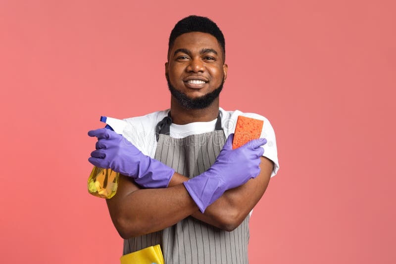 Confident Black Janitor Wearing Apron with Sponge and Spray Detergent