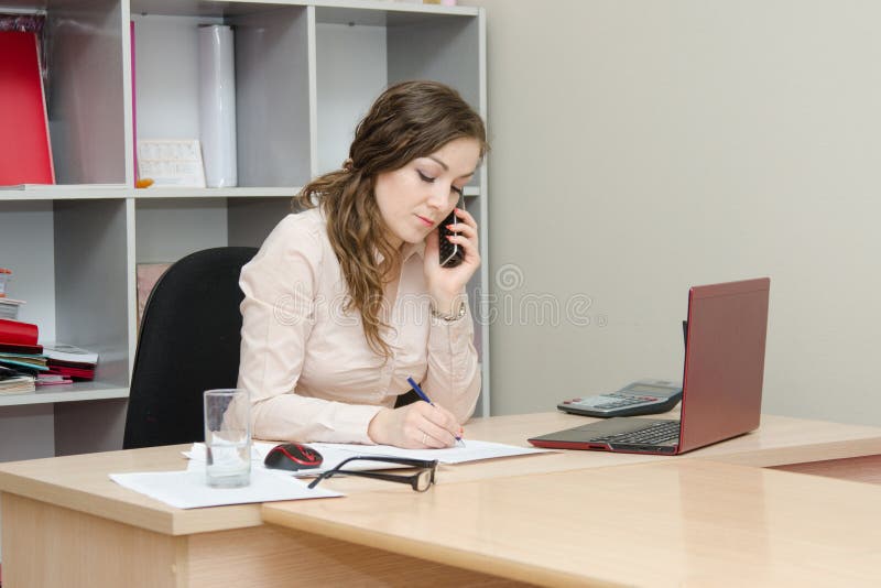 Confident business woman calling by phone stock photo Confident business woman calling by phone stock photo