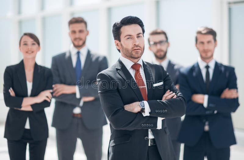 Confident businessman in front of his business team royalty free stock photo Confident businessman in front of his business team royalty free stock photo