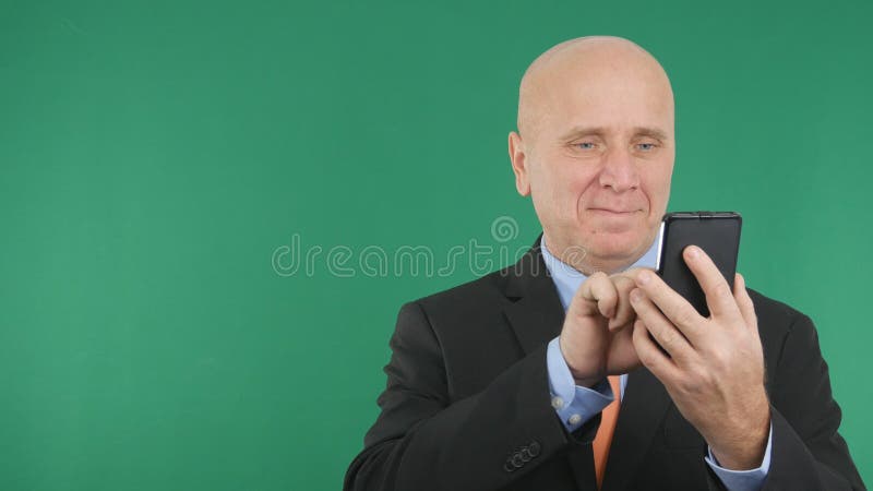 Confident Businessman Image Text Using Cell Phone royalty free stock image