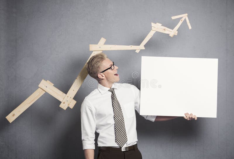 Confident businessman with white empty panel. royalty free stock image