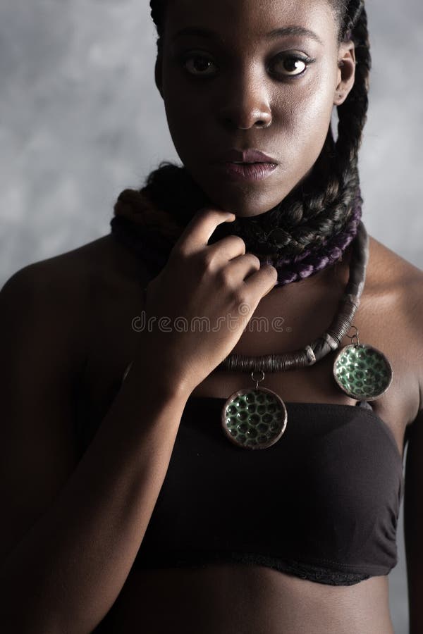 Fashionable young curly african american woman in studio 