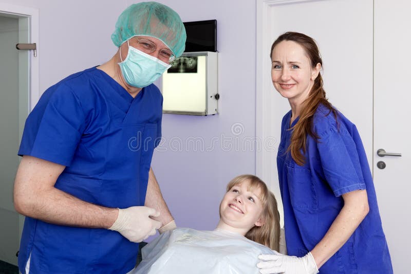 Confident Dental Surgeon, Assistant and Patient. Stock Image Image of