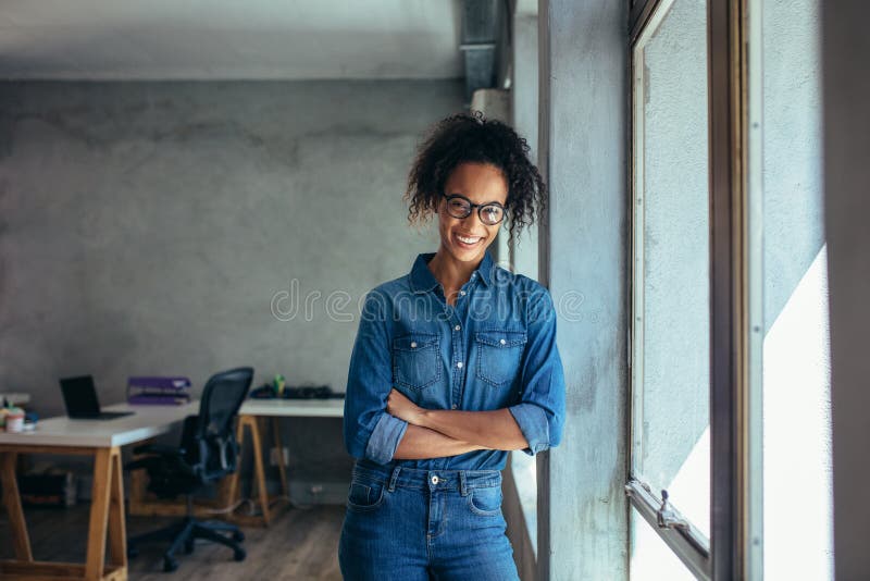 Confident entrepreneur in her office royalty free stock photos Confident entrepreneur in her office royalty free stock photos