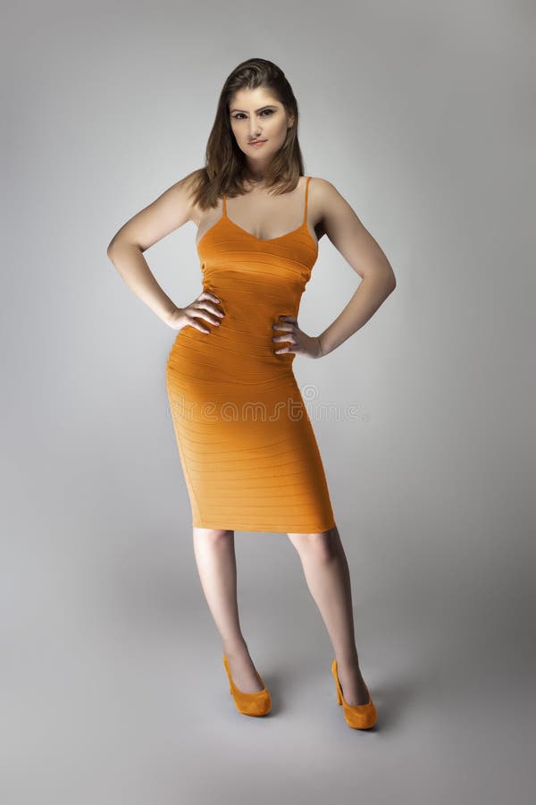 Female Model Wearing a Mustard Colored Dress Stock Image - Image of ...