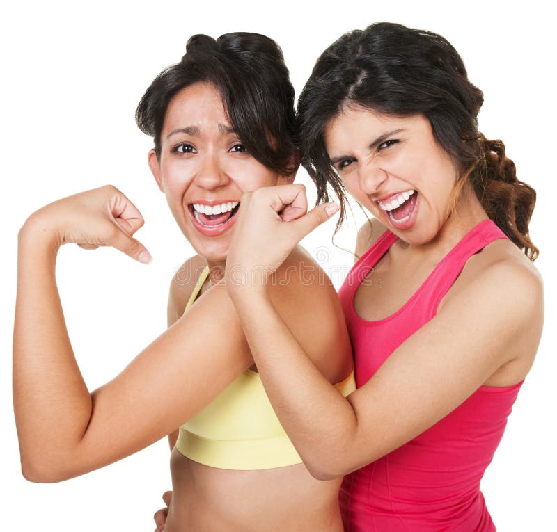 Woman flexing biceps and smiling - Stock Photo - Masterfile