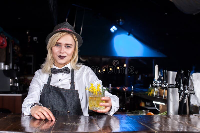 Young Woman Barkeeper Makes a Show Creating a Cocktail on the Bar Stock ...