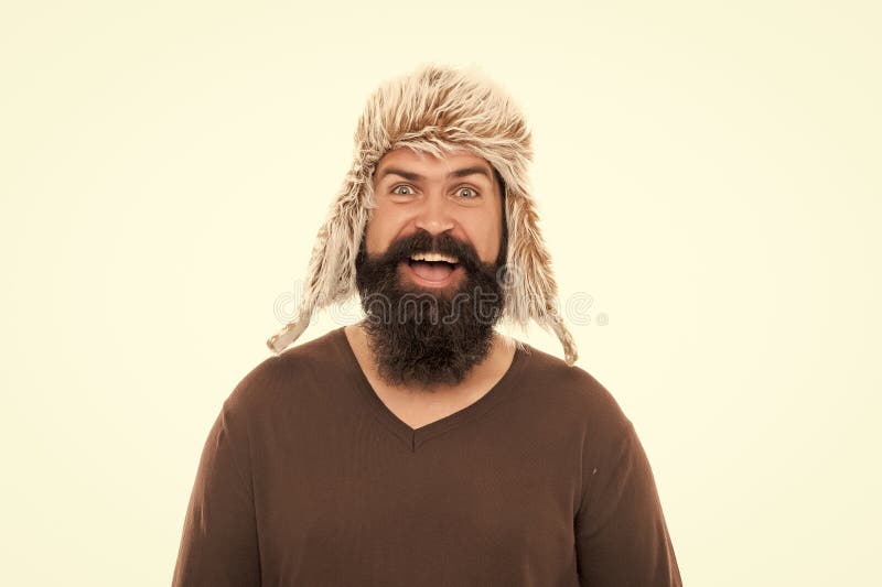 Confident guy with moustache wear warm hat. male winter fashion. mens beauty. royalty free stock photography