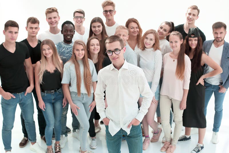 Confident guy standing in front of a group of young people royalty free stock photos
