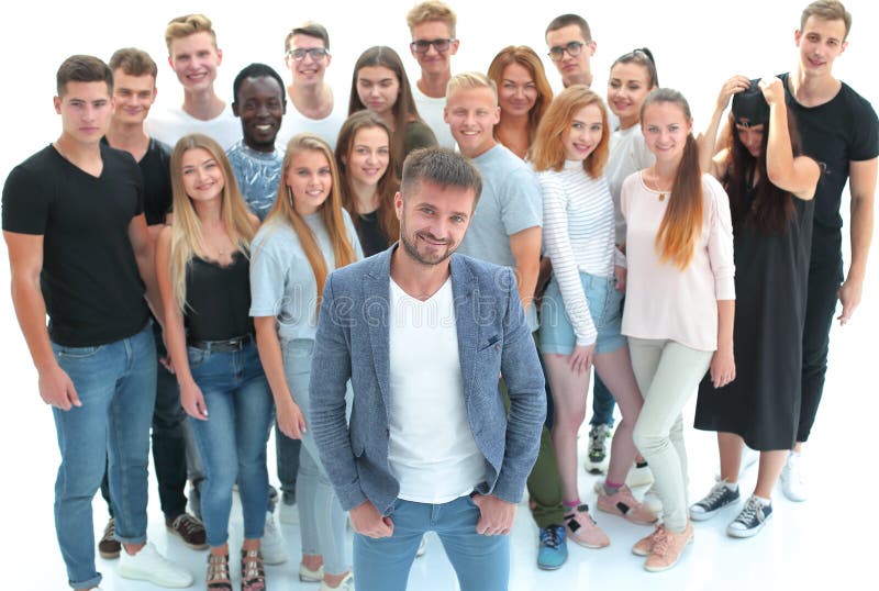 Confident guy standing in front of a group of young people royalty free stock photos