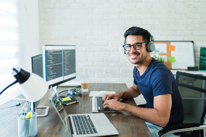 Confident Hispanic Software Developer Tying on Keyboard Stock Photo - Image  of freelancer, male: 160369322