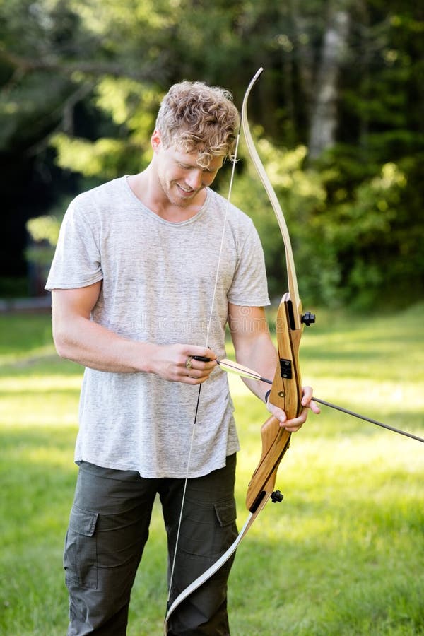 Male Archer with Wooden Bow Stock Photo Image of hobby, pose 156319450