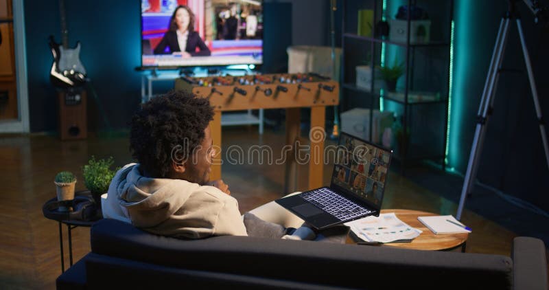 Confident male speaker greeting colleagues on a video conference meeting royalty free stock images