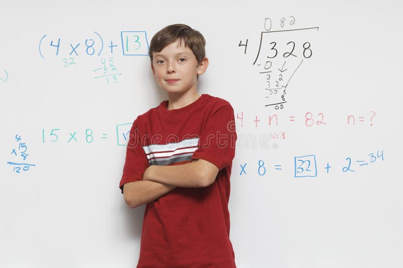 Confident Male Student Standing With Hands Folded stock photo