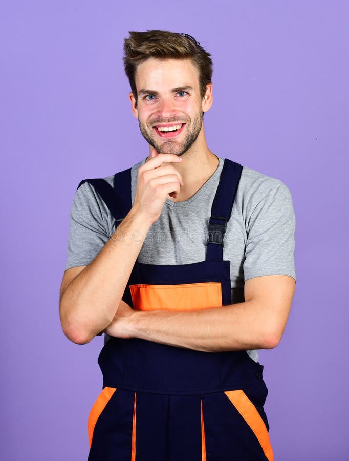 Confident mechanic. man build house. skilled architect repair and fix. building skills and construction. worker purple royalty free stock image