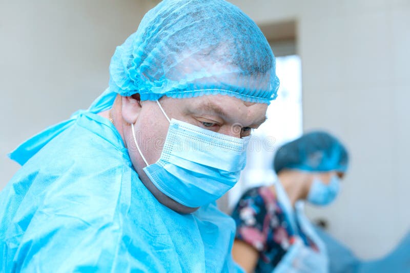 Confident Serious Surgeon In Surgical Room Hospital Medical Doctor confident-serious-surgeon-in-surgical-room-hospital-medical-doctor