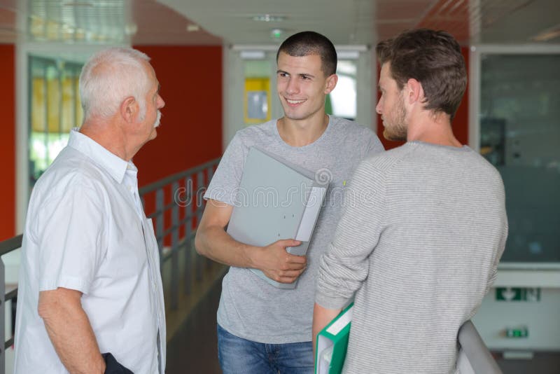 Confident smiling students in library royalty free stock photos