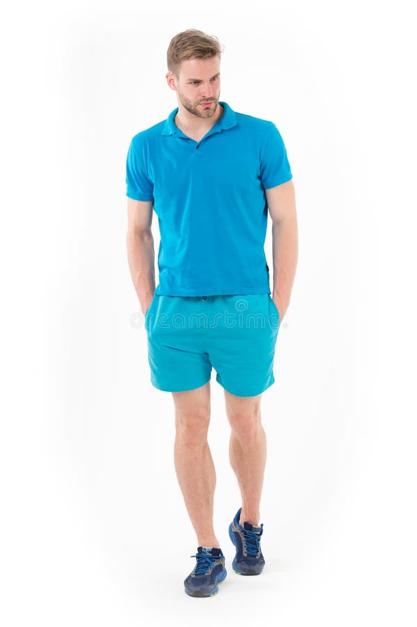Confident sportsman. Full length handsome fit man in blue sports clothing and sneakers isolated white background stock images Confident sportsman. Full length handsome fit man in blue sports clothing and sneakers isolated white background stock images