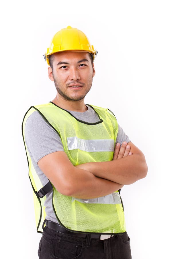 Confident, strong construction worker crossing his arms stock photo Confident, strong construction worker crossing his arms stock photo