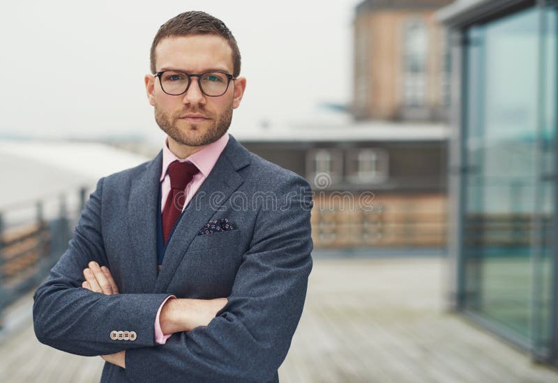 Confident stylish businessman on a balcony royalty free stock image Confident stylish businessman on a balcony royalty free stock image