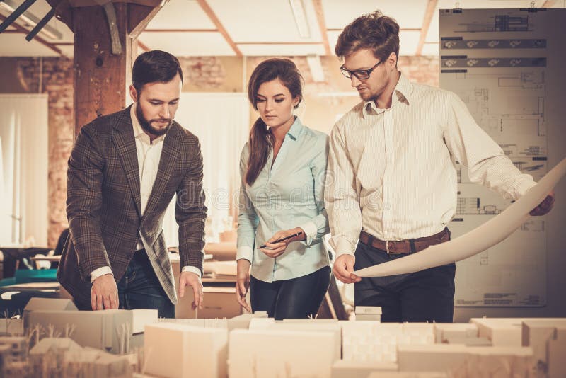 Confident team of engineers working together in a architect stud royalty free stock images