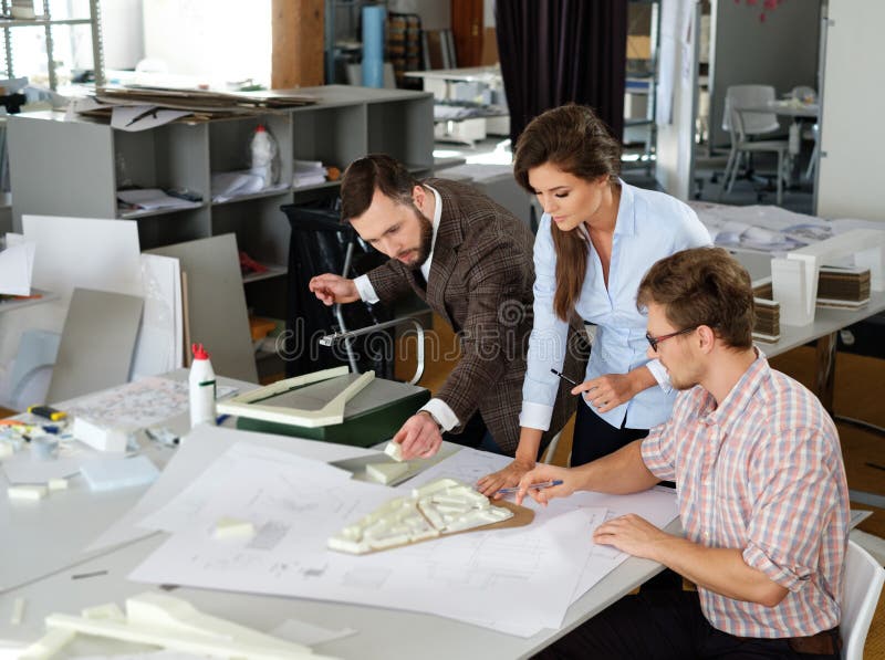 Confident team of engineers working together in a architect stud royalty free stock photography