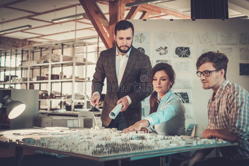 Confident team of engineers working together in a architect stud stock photos