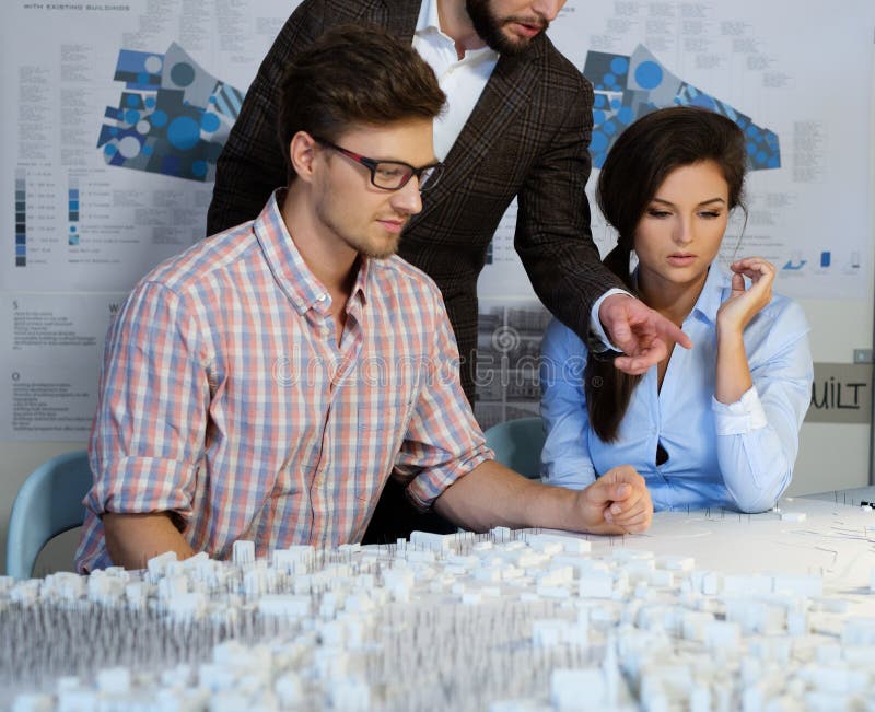 Confident team of engineers working together in a architect stud royalty free stock image