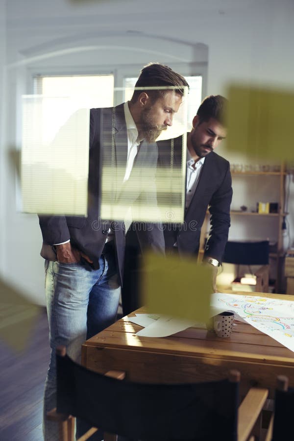 Confident team of engineers working together in a architect studio stock images Confident team of engineers working together in a architect studio stock images