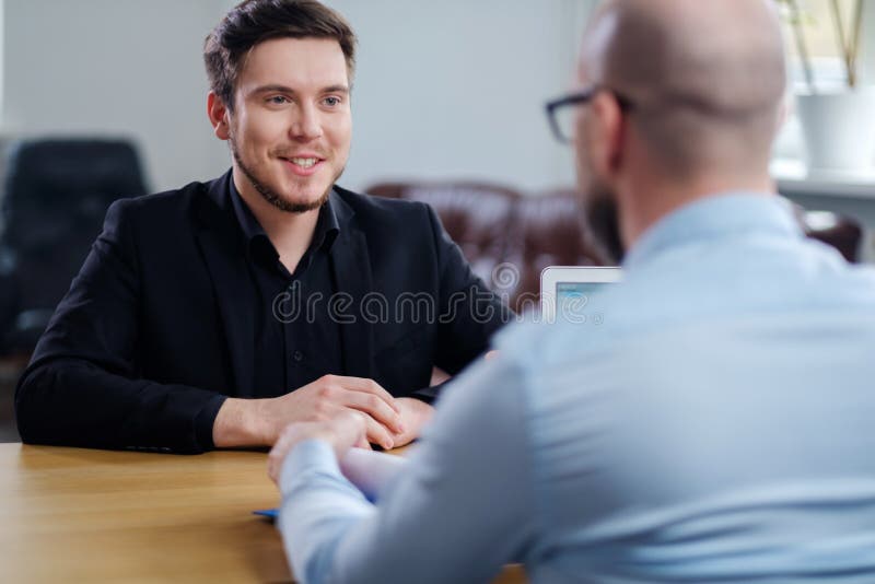 Confident young man attending job interview