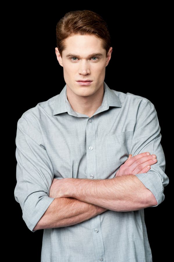 Confident young smart guy stock photo