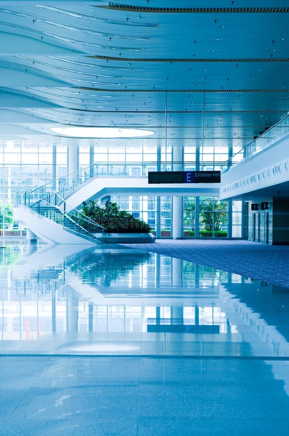 Modern architecture of large business conference center with blue tone. Modern architecture of large business conference center with blue tone.