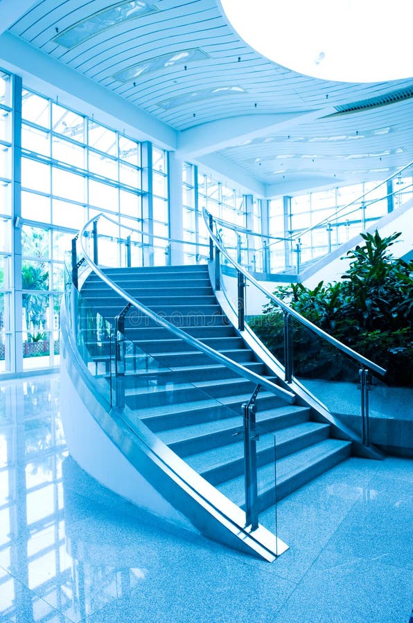 Modern architecture of large business conference center with blue tone. Modern architecture of large business conference center with blue tone.