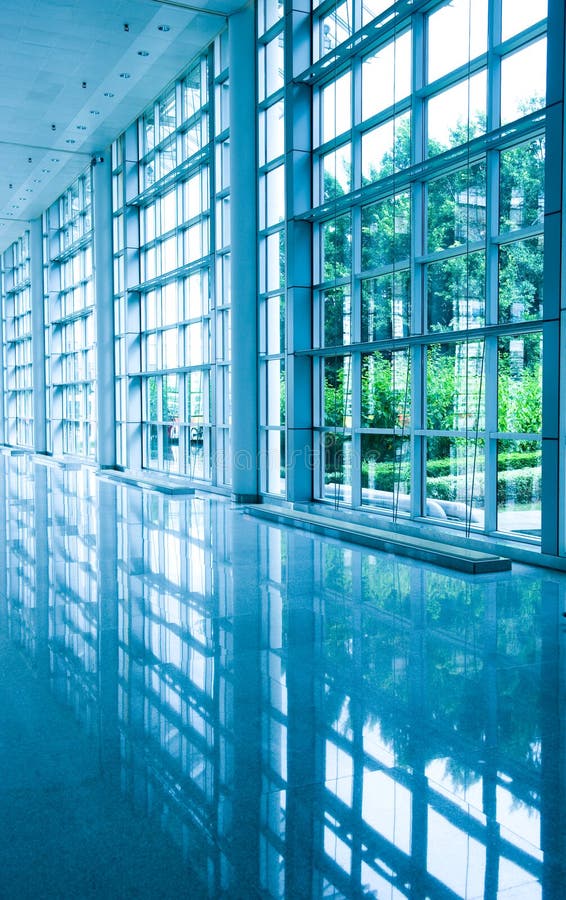 Modern architecture of large business conference center with blue tone. Modern architecture of large business conference center with blue tone.