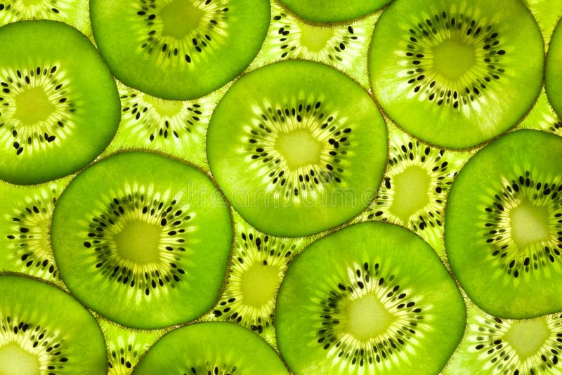 Configuration/fond/arrière frais de kiwi allumé image stock Configuration/fond/arrière frais de kiwi allumé image stock