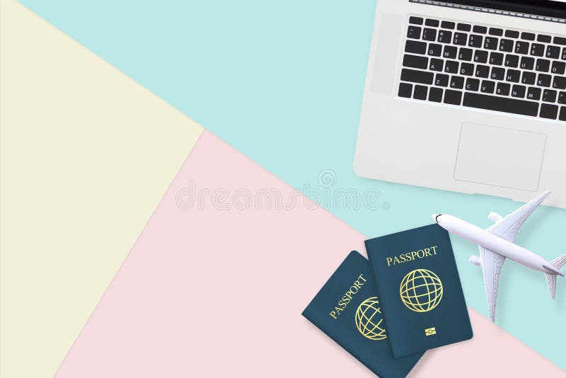 Flat lay of passport , white plane model and computer laptop on pastel blue ,yellow and pink color background with copy space. travel , visa and vacation concept. Flat lay of passport , white plane model and computer laptop on pastel blue ,yellow and pink color background with copy space. travel , visa and vacation concept