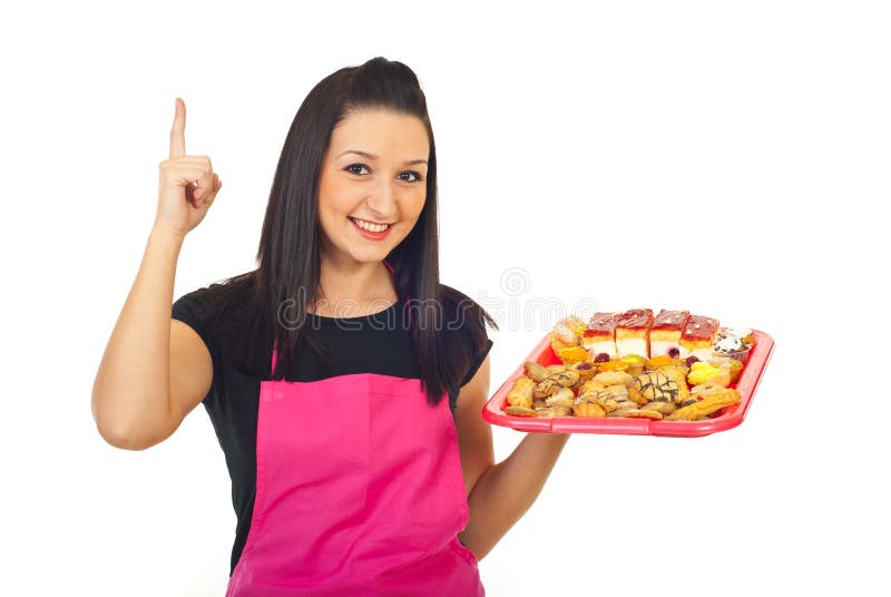 Confitero con las tortas que destaca foto de archivo Confitero con las tortas que destaca foto de archivo