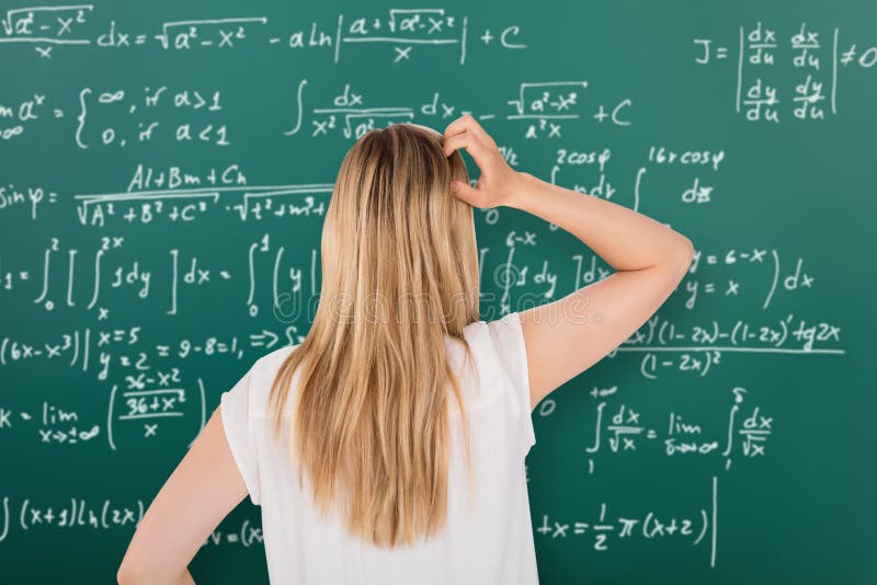 Математика в домашних условиях. Девушка у доски решает проблему. Алгебра девушка. Алгебра стоковые фото. Доска решения проблем.