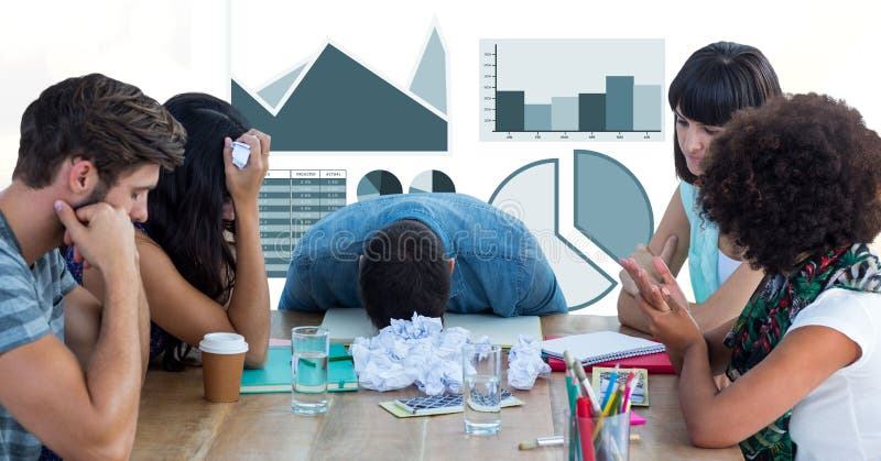Confused business people with paper balls against graphs stock photo Confused business people with paper balls against graphs stock photo