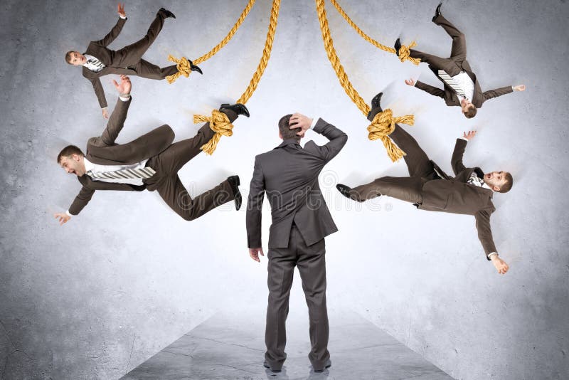 Confused Businessman Looking on Hanging People Stock Image - Image of
