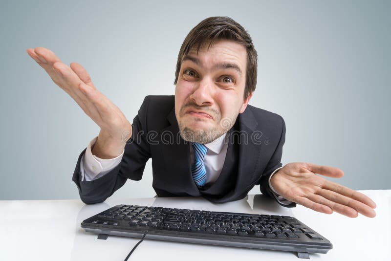 Confused frustrated and unsure man is working with computer