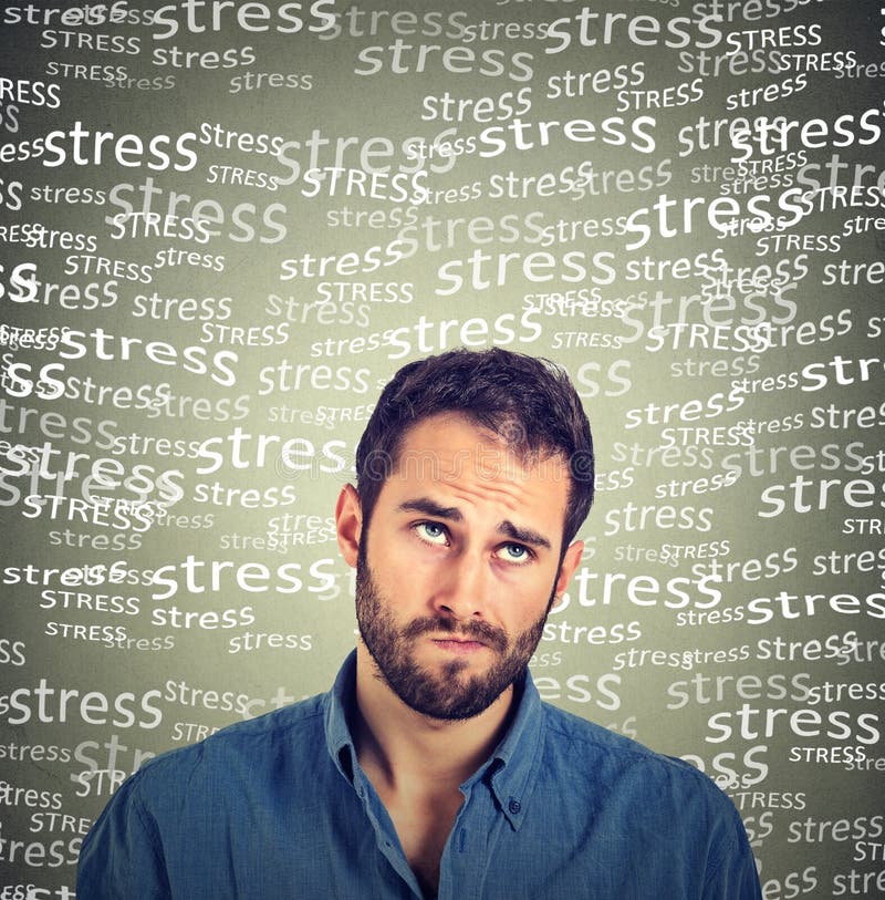 Confused skeptical young man thinking looking up under stress pressure