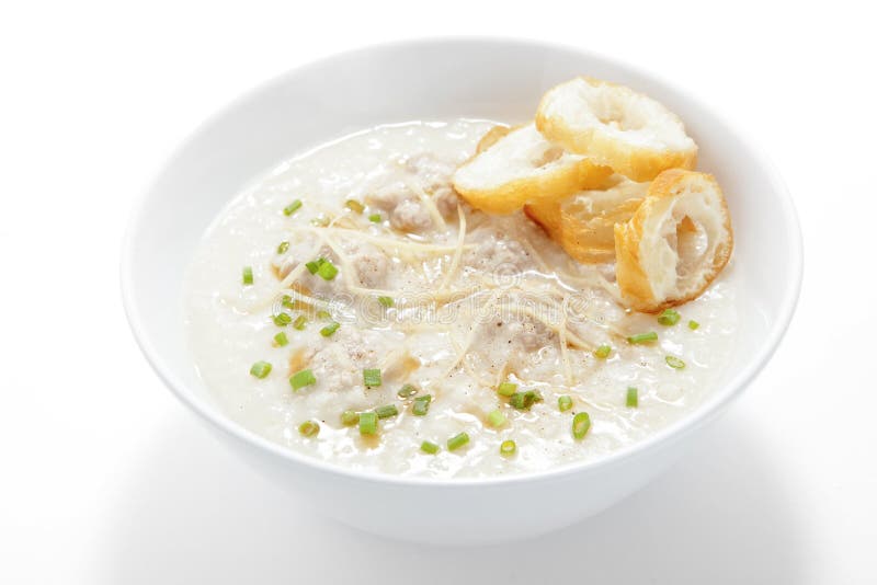 Congee χοιρινού κρέατος με τη φέτα που τσιγαρίζεται doughstick στοκ φωτογραφία με δικαίωμα ελεύθερης χρήσης Congee χοιρινού κρέατος με τη φέτα που τσιγαρίζεται doughstick στοκ φωτογραφία με δικαίωμα ελεύθερης χρήσης