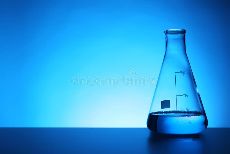 Conical flask with liquid on table against color background. stock image