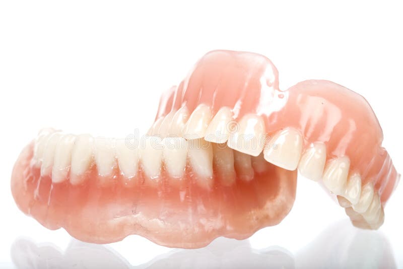 Full set of acrylic denture on white background. Full set of acrylic denture on white background