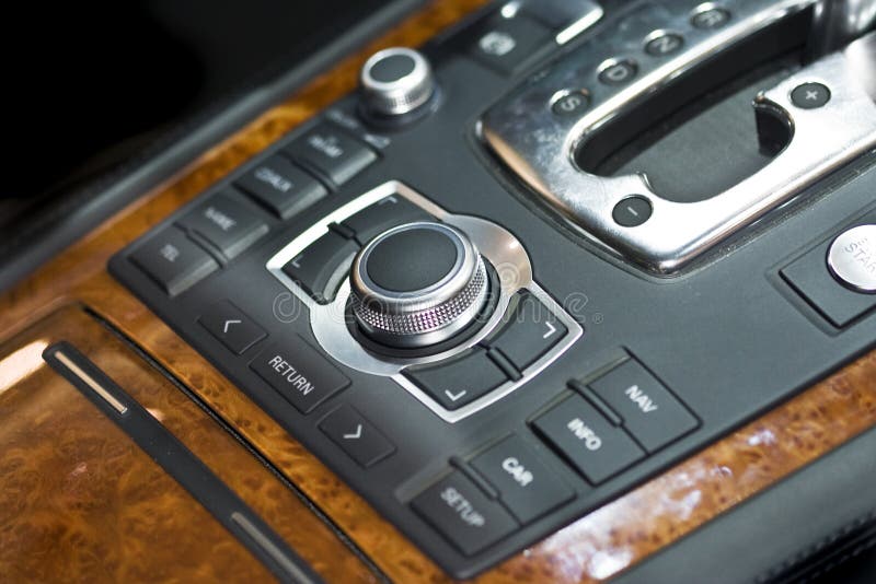 A very nicely, wood-trim automobile central console. A very nicely, wood-trim automobile central console
