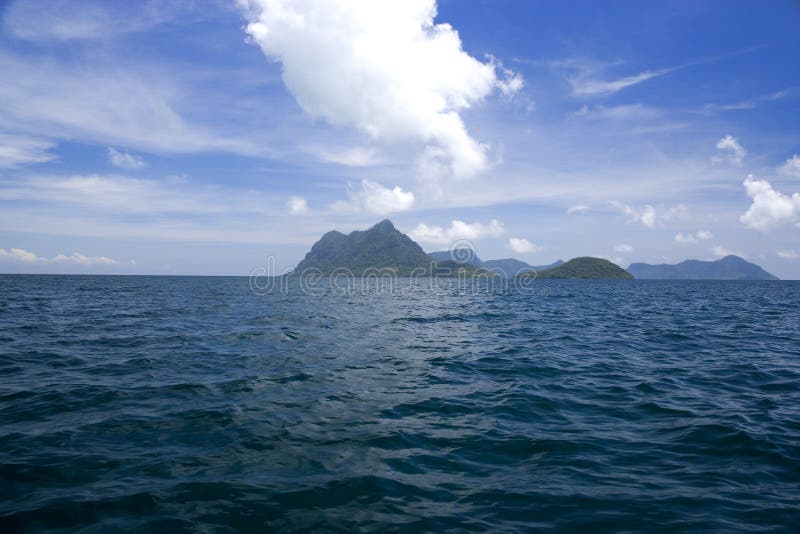 Image of remote Malaysian tropical islands that were formerly the rim of a volcano, now extinct. Image of remote Malaysian tropical islands that were formerly the rim of a volcano, now extinct.