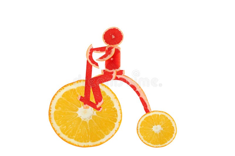 Consommation saine. Le vélo drôle de vintage fait de l'orange découpe W en tranches photos stock Consommation saine. Le vélo drôle de vintage fait de l'orange découpe W en tranches photos stock